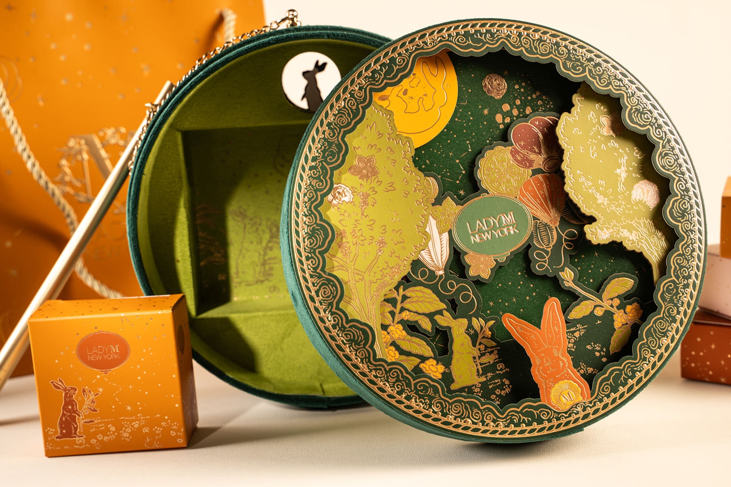 Lady M gift box open to reveal a laser cut rabbit