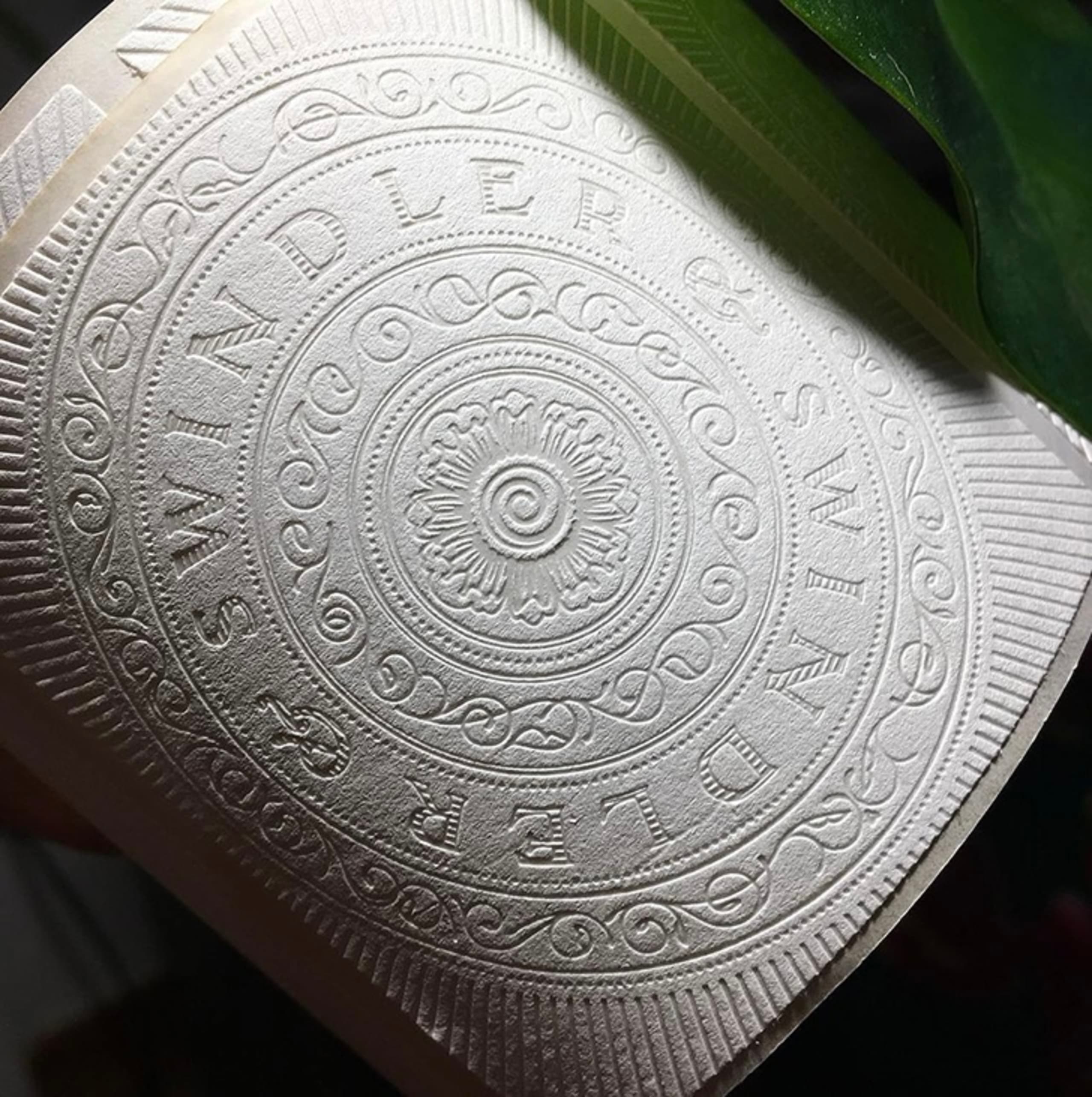 illustrated label close-up with botanical background